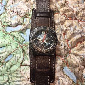 Fossil men’s multi function date cuff.